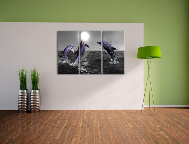 Fröhliche Delfine springen im Meer schwarz/weiss 3-Teiler Leinwandbild 120x80 Bild auf Leinwand, XXL