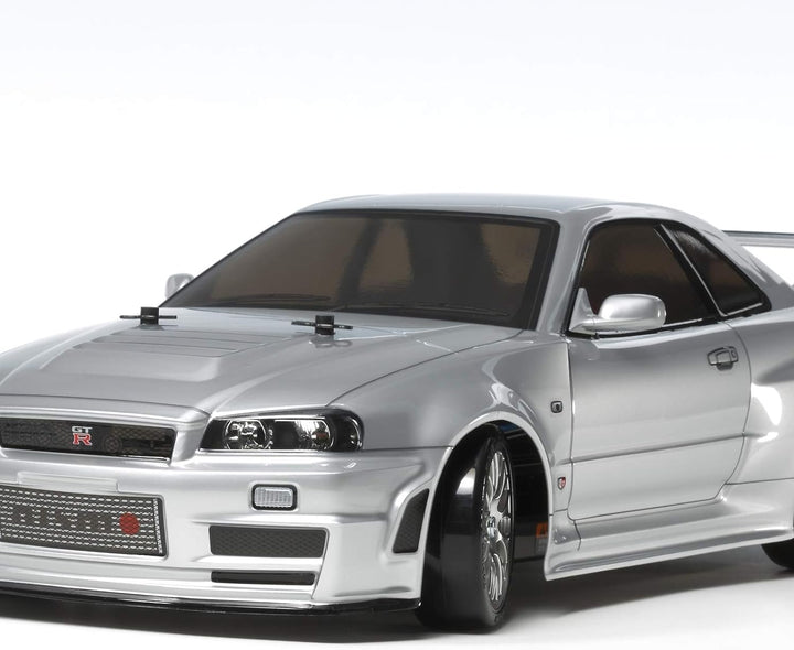 TAMIYA 300058605-1:10 RC Nismo R34 GT-R Z-Tune (TT-02D) & Carson 500500091 RC-Reflex Pro 3 Elektro S