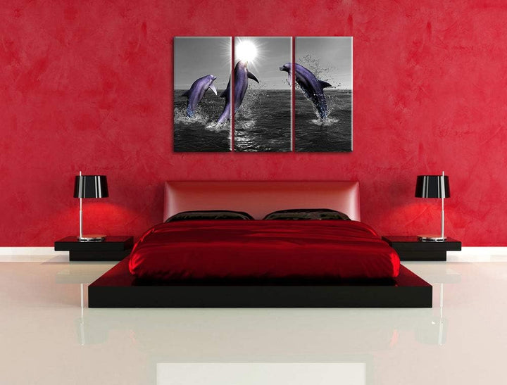Fröhliche Delfine springen im Meer schwarz/weiss 3-Teiler Leinwandbild 120x80 Bild auf Leinwand, XXL