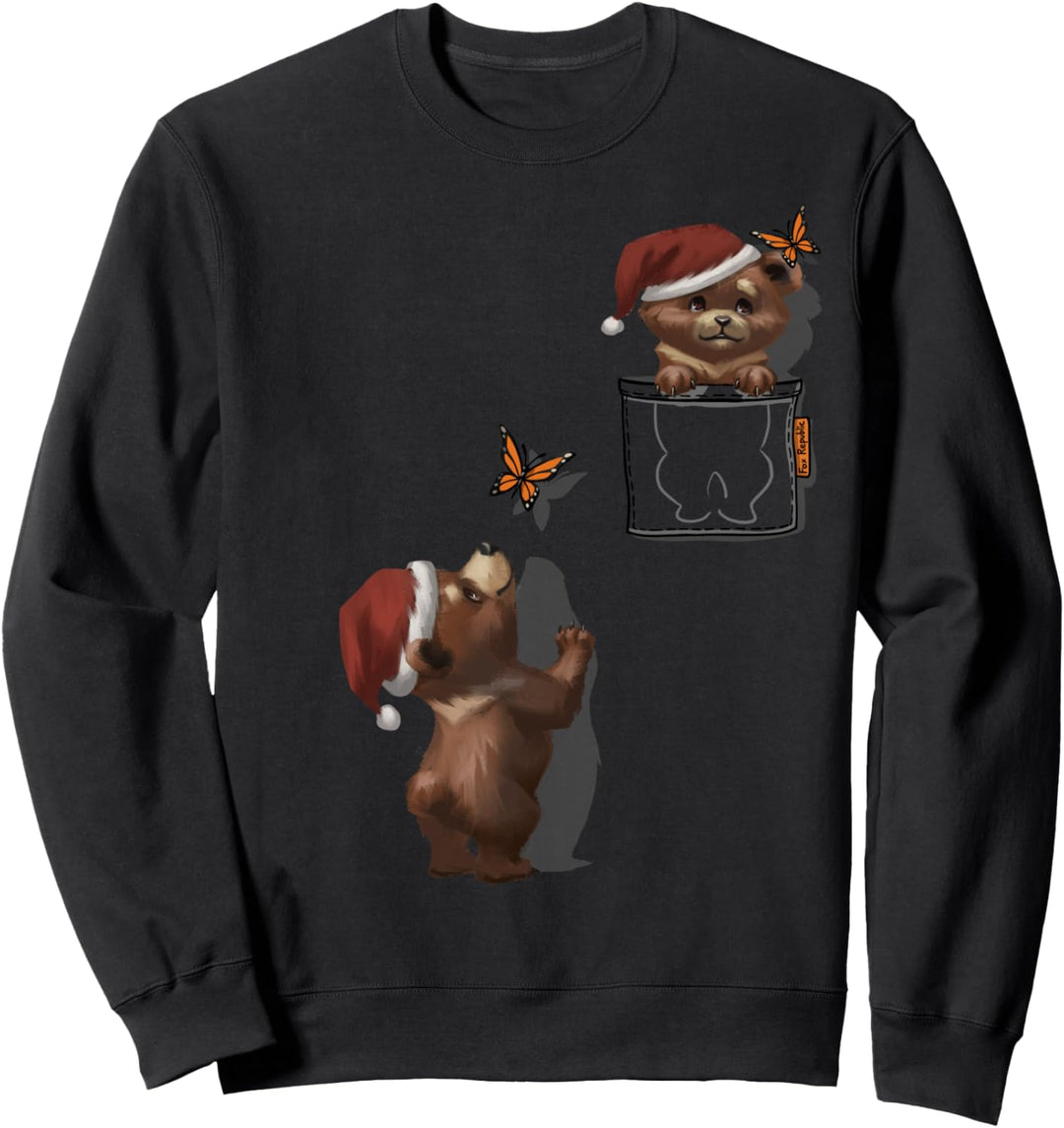 Netter Bär in der Weihnachtsmütze, die in der Tasche spielt Sweatshirt