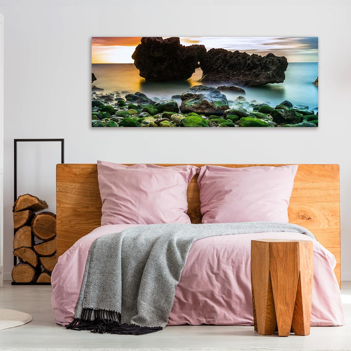 wandmotiv24 Leinwandbild Strand bei Sonnenuntergang mit Felsen 100x40cm (BxH) Bilder auf Leinwand, D