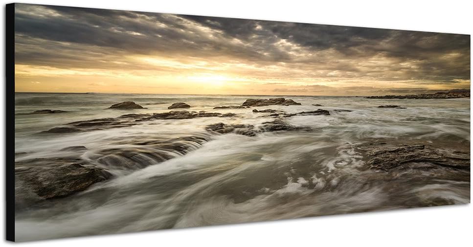 Paul Sinus Art Panoramabild auf Leinwand und Keilrahmen 150x50cm Meer Steine Felsen Wolken Sonnenauf