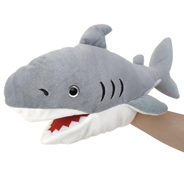 Das Leben ist eine Puppe, die mit einem bunten und beweglichen Mund gefüllt ist De-shark, De-shark