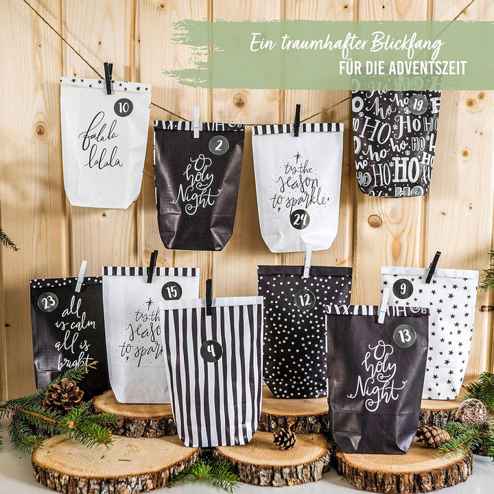 Papierdrachen Adventskalender zum Befüllen - 24 schwarze und weisse bedruckte Geschenktüten und 24 Z