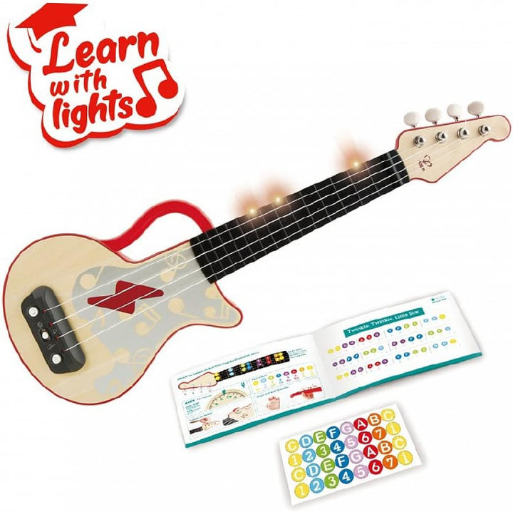 Hape Elektrische Ukulele mit stimmbaren Saiten und Führungslichtern für Kinder ab 3 Jahren, rot