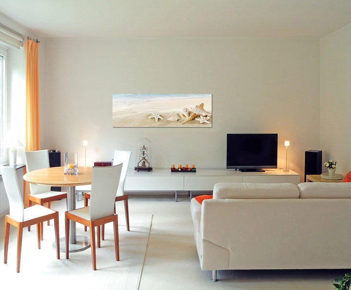 Paul Sinus Art Panoramabild auf Leinwand und Keilrahmen 150x50cm Sandstrand Meer Muscheln Schneckenh