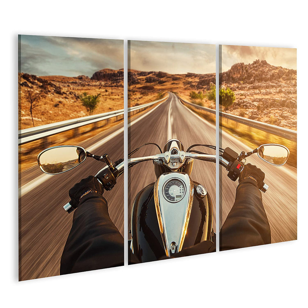 islandburner Bild auf Leinwand Motorrad Fahrer auf einsamen US Highway im Sonnenuntergang Bilder Wan