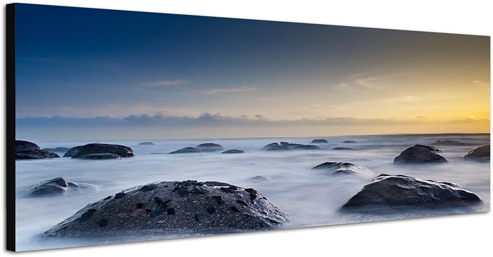 Paul Sinus Art Panoramabild auf Leinwand und Keilrahmen 150x50cm Meer Strand Steine Nebel Abenddämme