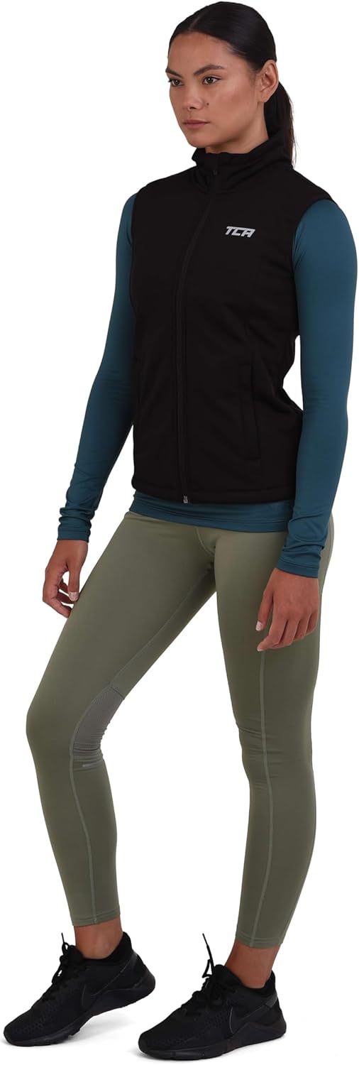 TCA Damen Flyweight winddichte Lauf- und Fahrradweste mit Reissverschlusstaschen, XS Schwarz