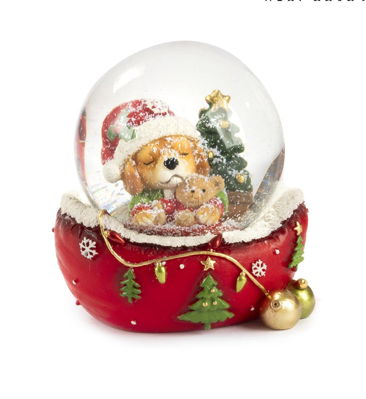 Schneekugel mit Welpe Hund, festliche Dekoration aus Harz, roter Sockel mit Weihnachtsbäumen und Sch