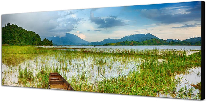 Paul Sinus Art Panoramabild auf Leinwand und Keilrahmen 150x50cm See Gras Boot Berge Landschaft Dämm