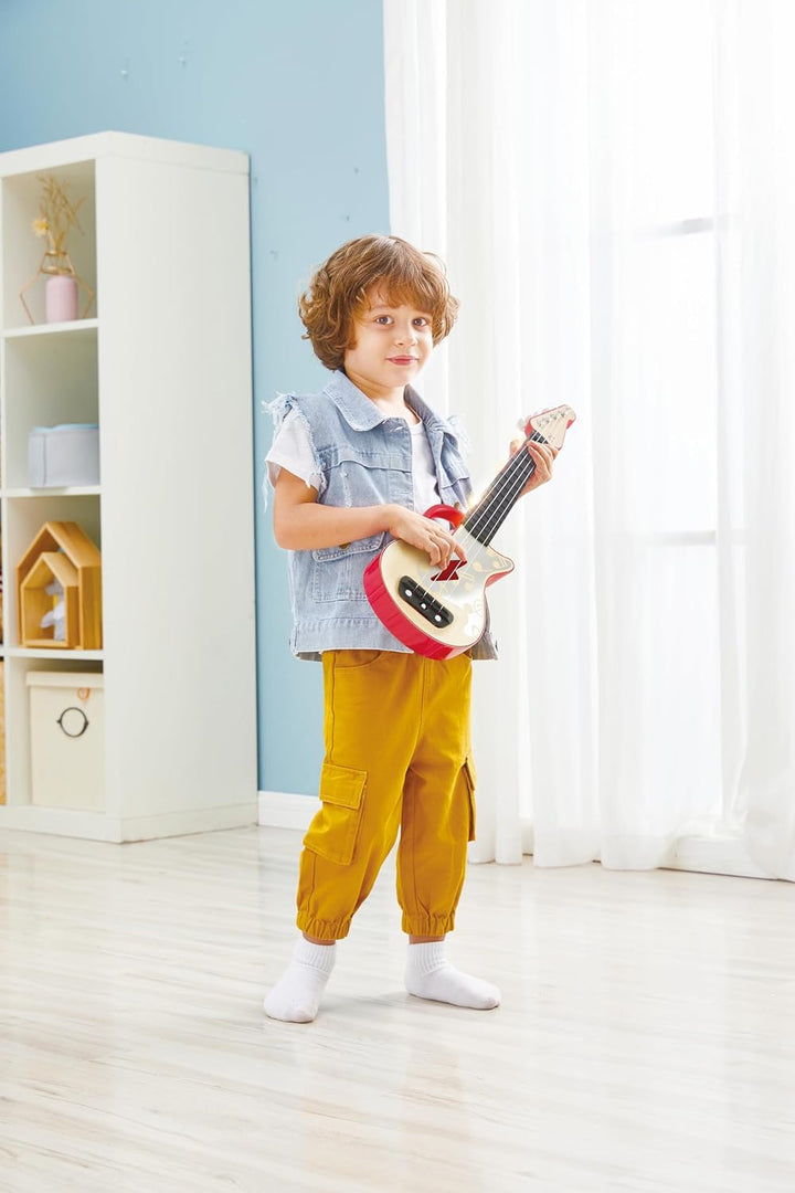 Hape Elektrische Ukulele mit stimmbaren Saiten und Führungslichtern für Kinder ab 3 Jahren, rot