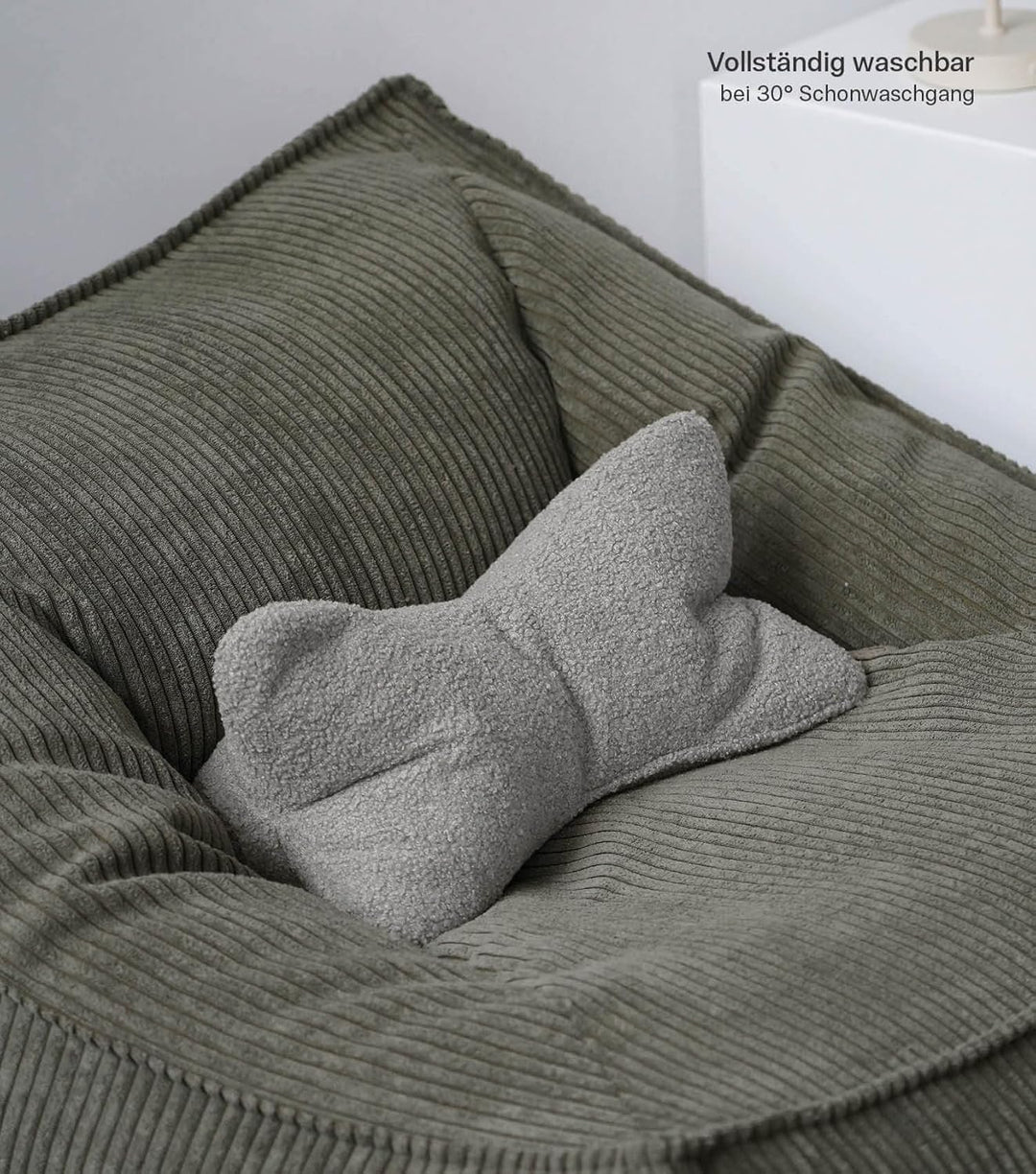 mokebo 'Der Leseknochen' Lesekissen aus weichen Bouclé-Stoff, ergonomisches Nackenkissen aus gemütli