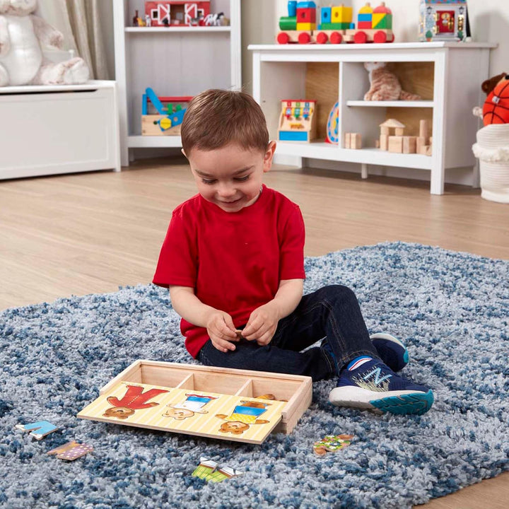 Melissa & Doug Mix 'n Match Holzpuzzle zum Ankleiden einer Bärenfamilie mit Aufbewahrungsbehälter (4