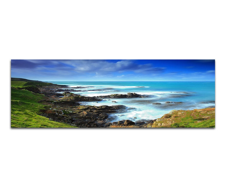 Paul Sinus Art Panoramabild auf Leinwand und Keilrahmen 150x50cm Neuseeland Küste Wiese Meer Wolken