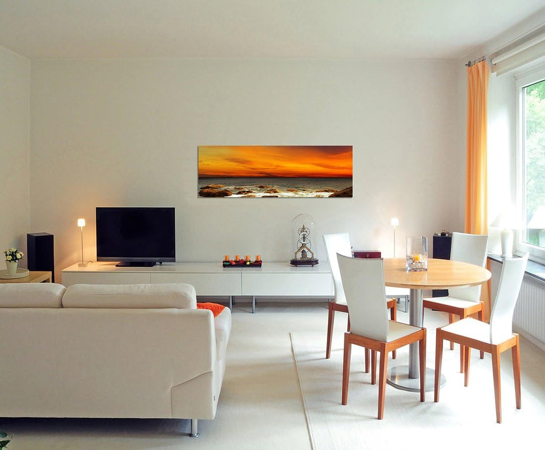 Paul Sinus Art Panoramabild auf Leinwand und Keilrahmen 150x50cm Meer Steine Felsen Abendrot Landsch