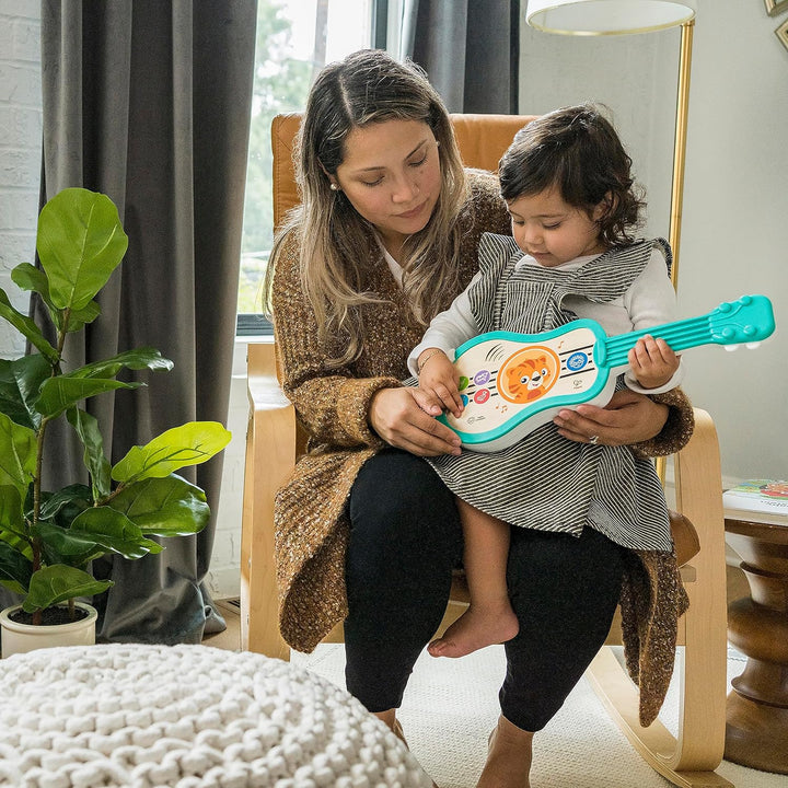 Baby Einstein 12609 Hape Sing & Strum Magic Touch Ukulele, Musikspielzeug aus Holz, mit 6 Melodien u
