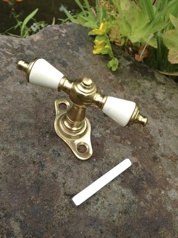 Antikas - Fensterolive aus Messing poliert, Porzellan, Gründerzeit Fenstergriffe