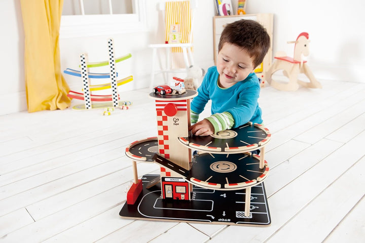 Parkhaus Spielset aus Holz von Hape | Autogarage auf drei Ebenen mit Autos und Hubschrauber
