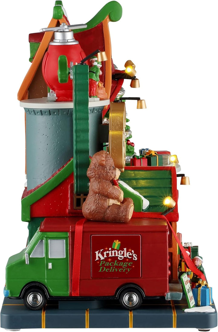 LEMAX Beleuchtetes und musikalisches Elfenkuriergebäude Kringle's Courier aus Harz H22,3x28x15 cm