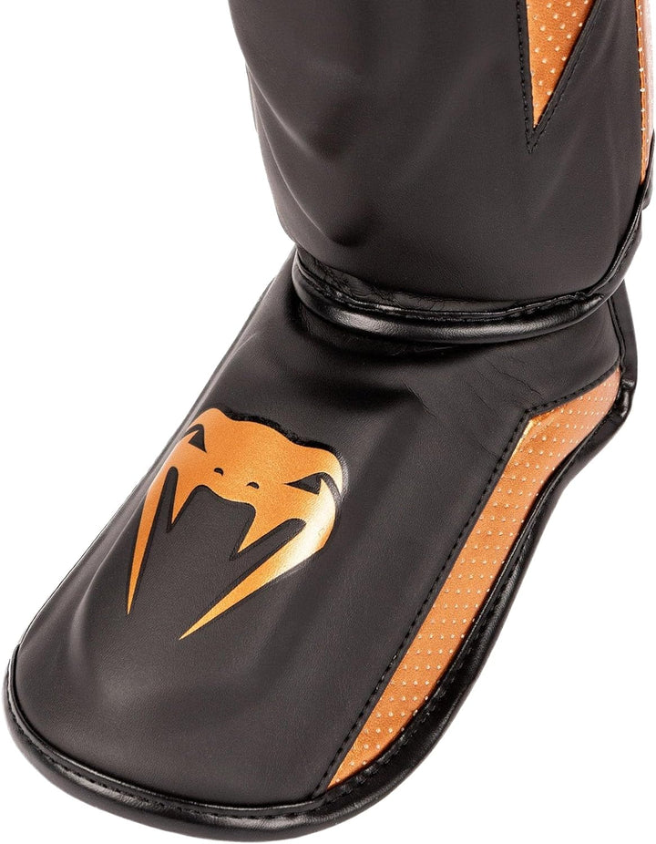 Venum Elite Evo Schienbeinschoner XL Schwarz / Bronze, XL Schwarz / Bronze