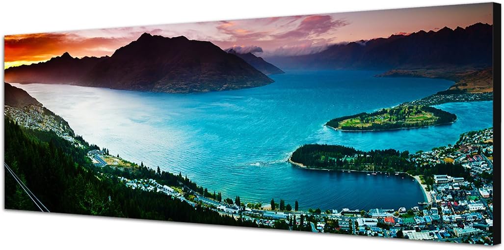 Paul Sinus Art Panoramabild auf Leinwand und Keilrahmen 150x50cm See Stadt Berge Landschaft Dämmerun