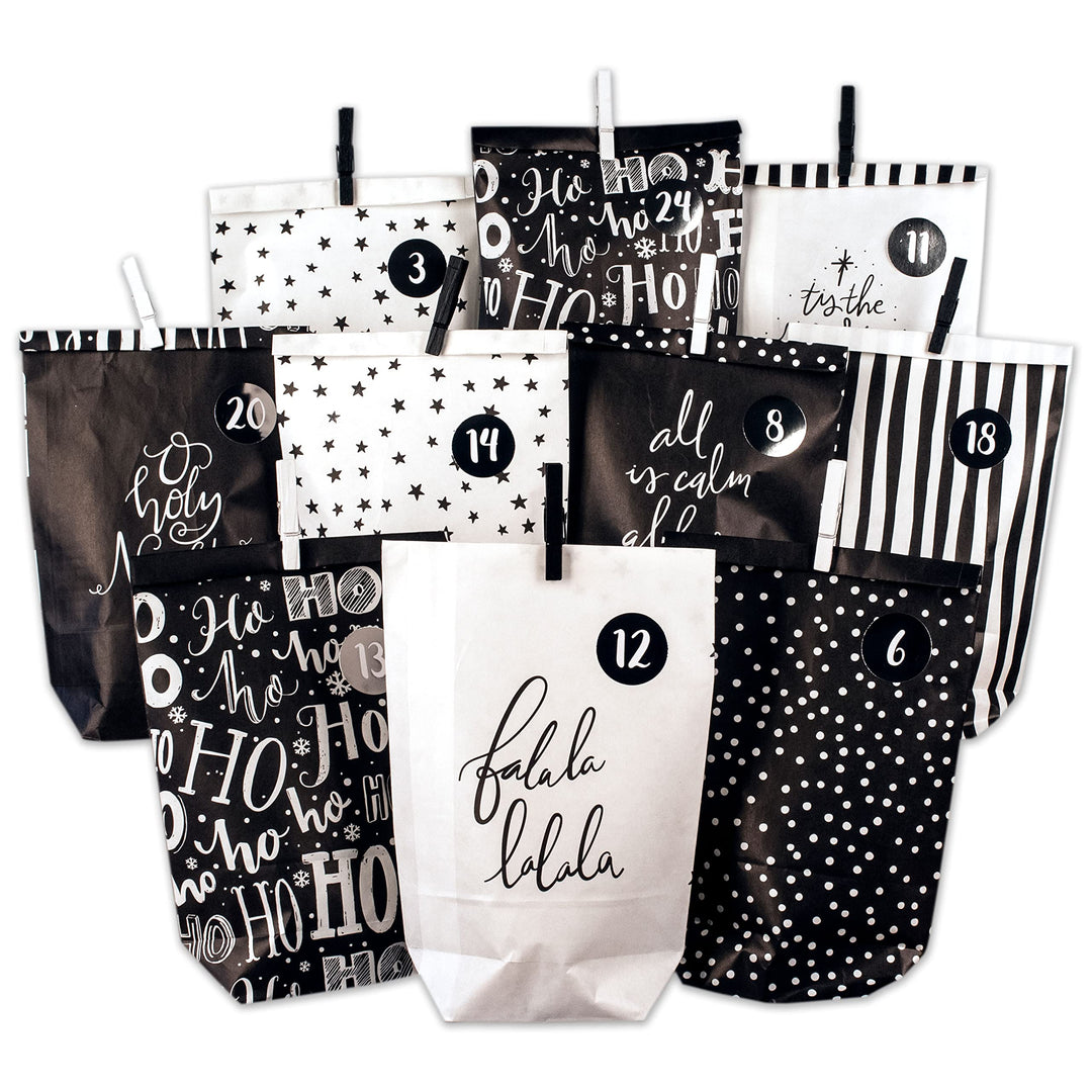 Papierdrachen Adventskalender zum Befüllen - 24 schwarze und weisse bedruckte Geschenktüten und 24 Z