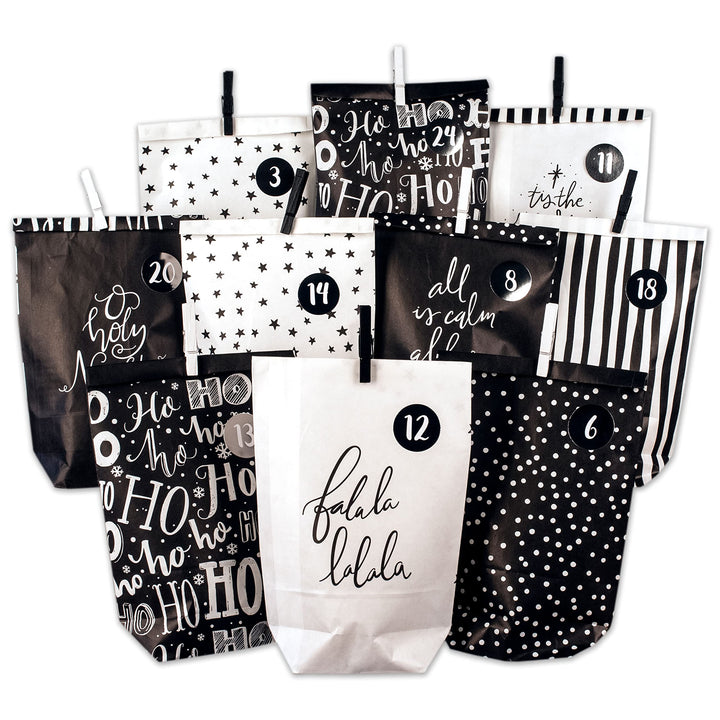 Papierdrachen Adventskalender zum Befüllen - 24 schwarze und weisse bedruckte Geschenktüten und 24 Z
