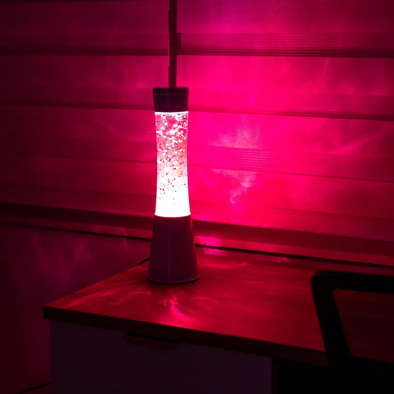 FISURA - Rosa Lavalampe. Weisser Sockel, rosa Flüssigkeit und glitzernde Herzen. Lampe mit Entspannu