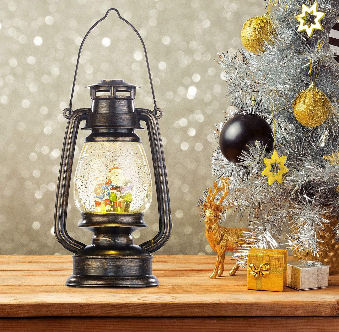 infactory Weihnachtslaternen: Deko-LED-Laterne im Öllampen-Look, mit Schneewirbel und Weihnachtsmann