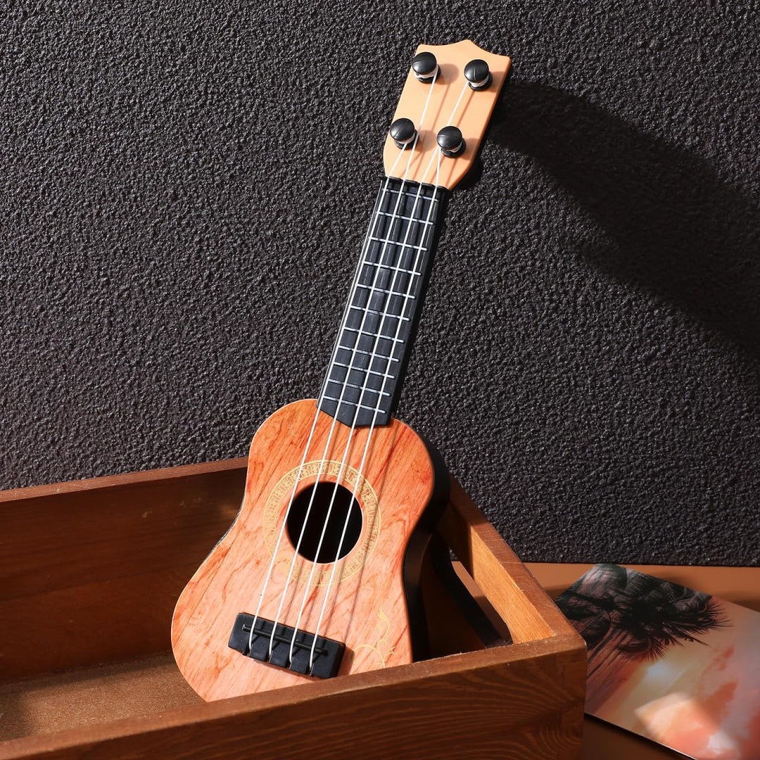 SAFIGLE 25cm Gitarre für Kinder：Mini Kindergitarre Ukulele Spielzeug 4-Saitige Musikgitarre Modell -