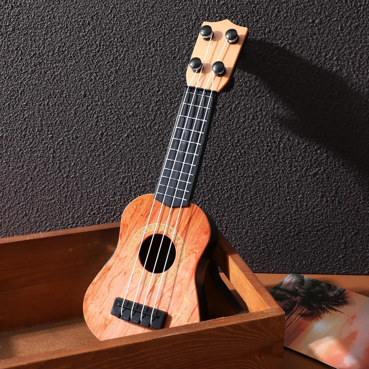 SAFIGLE 25cm Gitarre für Kinder：Mini Kindergitarre Ukulele Spielzeug 4-Saitige Musikgitarre Modell -