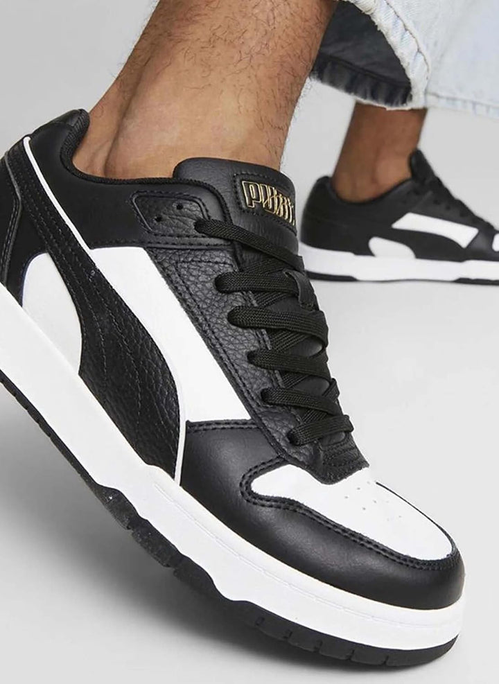 PUMA Unisex Rbd Game Low Leichtathletik-Schuh 45 EU Puma Black Puma White Puma Team Gold, 45 EU Puma