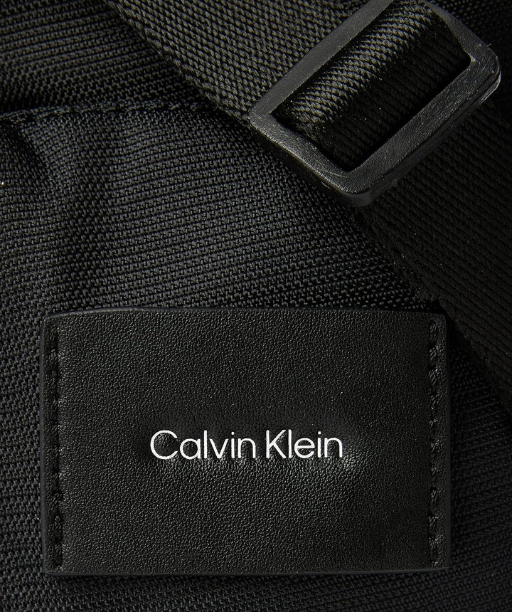 Calvin Klein Herren Must T Reporter Xs W/Pckt Crossovers, Ck Schwarz