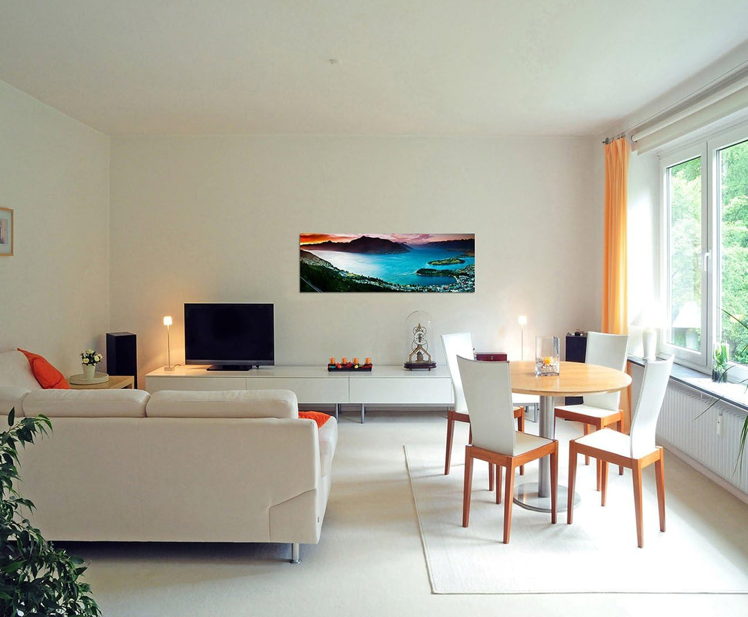 Paul Sinus Art Panoramabild auf Leinwand und Keilrahmen 150x50cm See Stadt Berge Landschaft Dämmerun