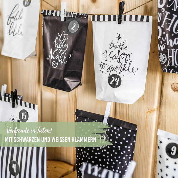 Papierdrachen Adventskalender zum Befüllen - 24 schwarze und weisse bedruckte Geschenktüten und 24 Z