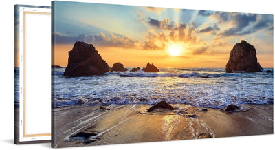 PICANOVA – Bild auf Leinwand Felsiger Strand Sonnenuntergang 100x50cm – Leinwandbild – Premium Leinw