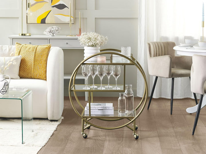 Beliani Servierwagen Glasplatte transparent/Gold mit Rollen glamourös Colton