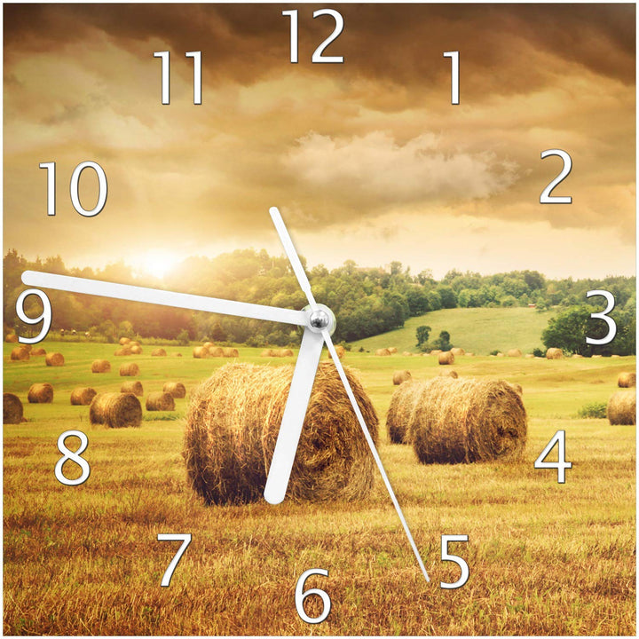 Wallario Design-Wanduhr Strohballen auf dem Feld bei Sonnenuntergang aus Glas, Motiv-Uhr Grösse 20 x