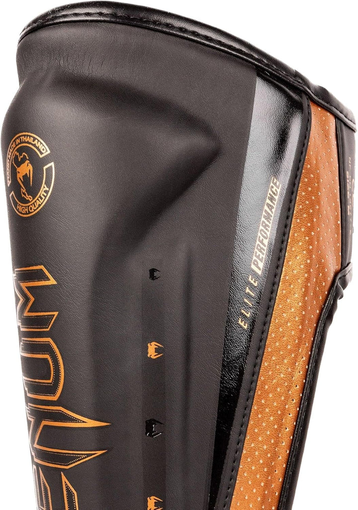 Venum Elite Evo Schienbeinschoner L Schwarz / Bronze, L Schwarz / Bronze