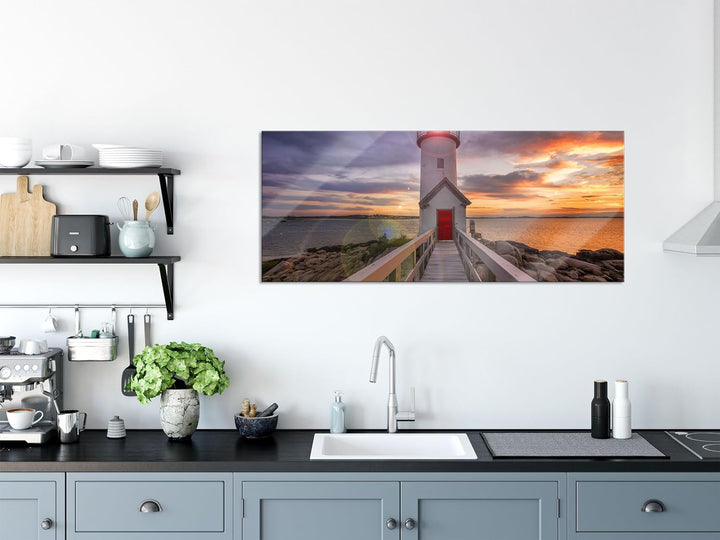 Glasbild Panorama | Wandbild aus Echtglas | Leuchtturm bei Sonnenuntergang | 100x40 cm | inkl. Aufhä