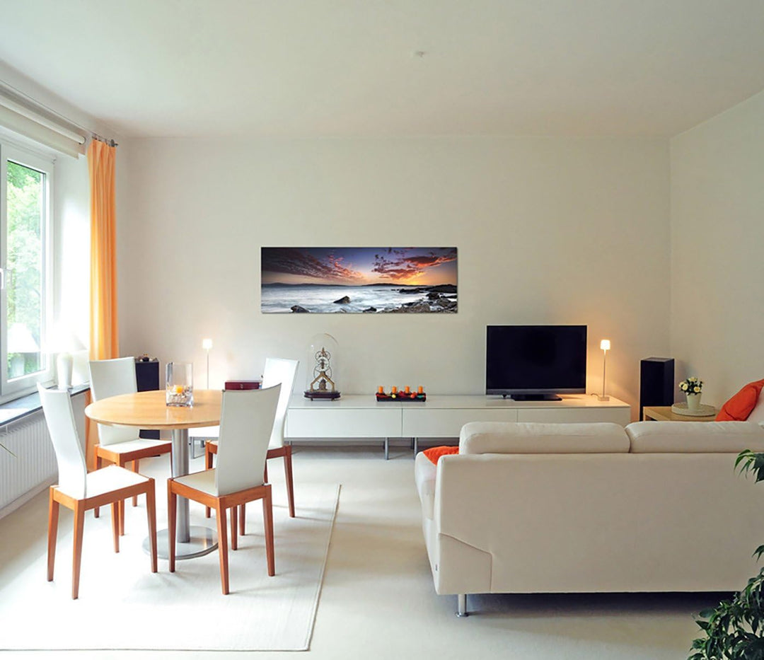 Paul Sinus Art Panoramabild auf Leinwand und Keilrahmen 150x50cm Meer Steine Felsen Abendhimmel