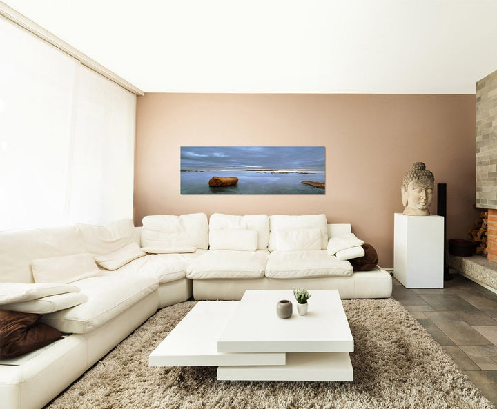 Paul Sinus Art Panoramabild auf Leinwand und Keilrahmen 150x50cm Meer Steine Wolken Dämmerung