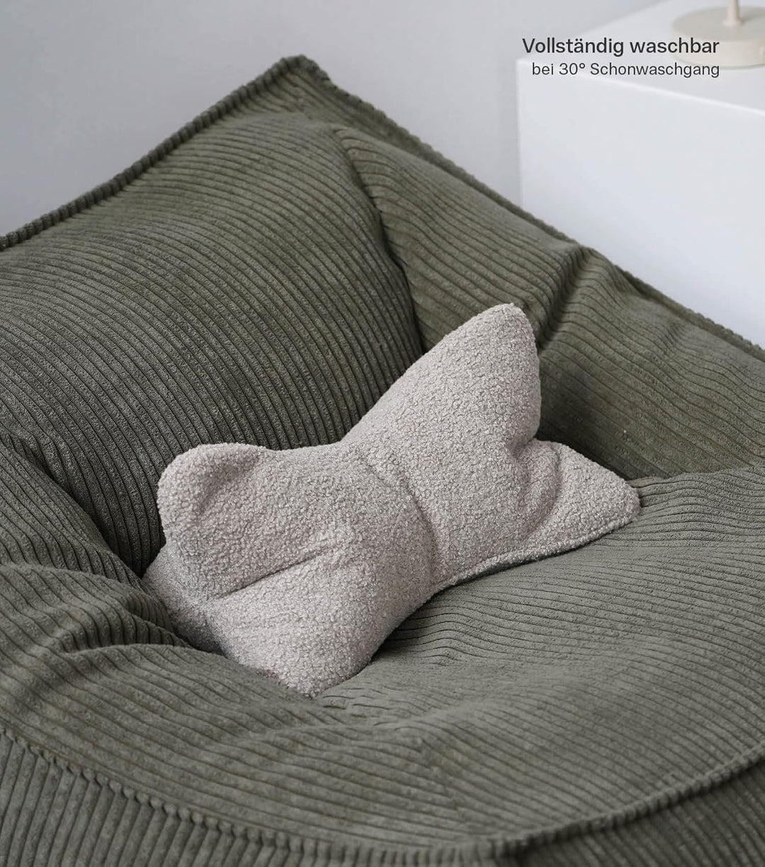 mokebo 'Der Leseknochen' Lesekissen aus weichen Bouclé-Stoff, ergonomisches Nackenkissen aus gemütli
