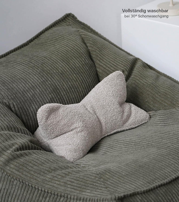 mokebo 'Der Leseknochen' Lesekissen aus weichen Bouclé-Stoff, ergonomisches Nackenkissen aus gemütli