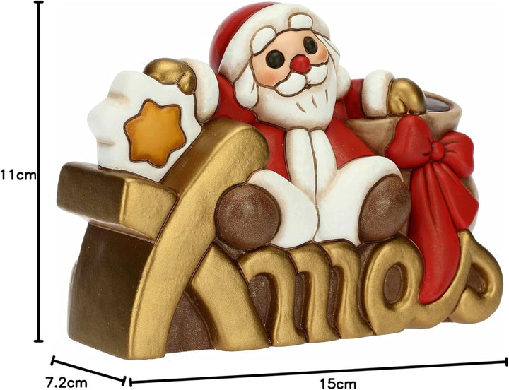 THUN - Weihnachten 2022 - Weihnachtsmann auf Xmas Schriftzug aus handverzierter Keramik - Weihnachts