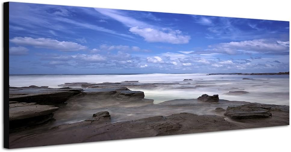 Paul Sinus Art Panoramabild auf Leinwand und Keilrahmen 150x50cm Meer Felsen Nebel Dämmerung
