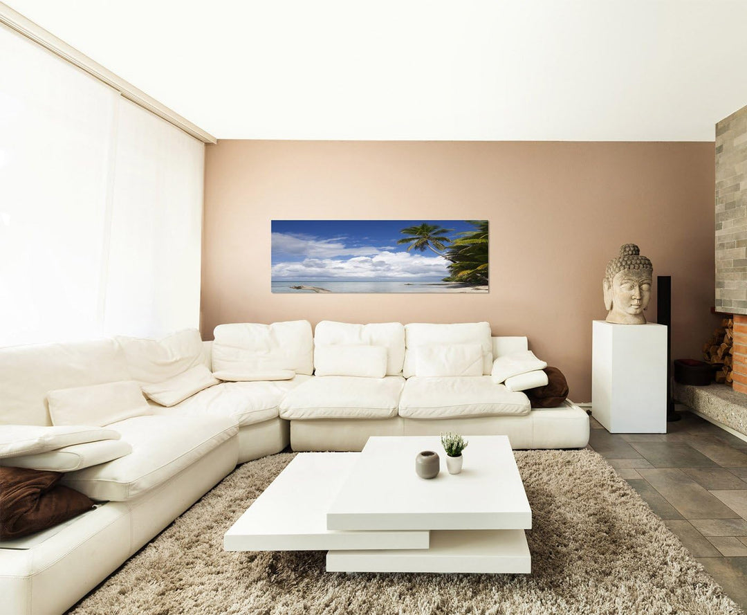 Paul Sinus Art Panoramabild auf Leinwand und Keilrahmen 150x50cm Strand Meer Wolken Palmen Holzstamm