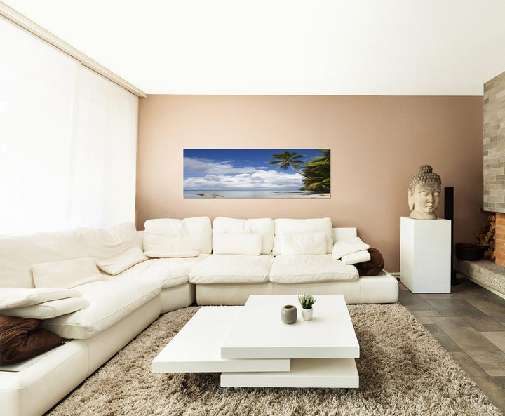 Paul Sinus Art Panoramabild auf Leinwand und Keilrahmen 150x50cm Strand Meer Wolken Palmen Holzstamm