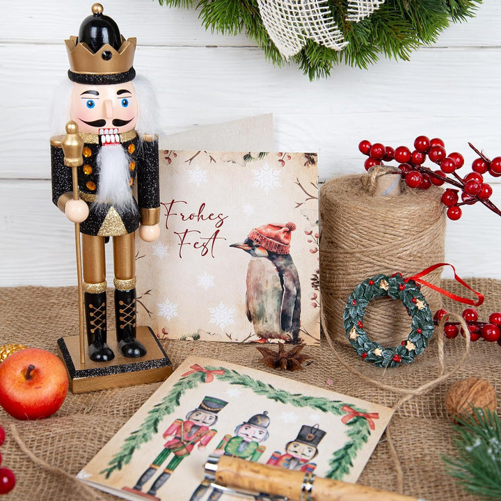 Logbuch-Verlag Nussknacker Figur schwarz Gold glitzernd aus Holz 26 cm Weihnachten König Dekofigur N